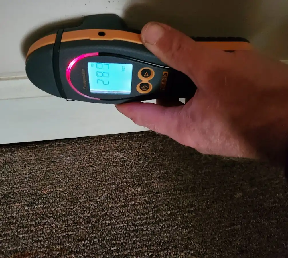 Moisture detection at baseboard during Storm Damage Restoration in Port Hueneme